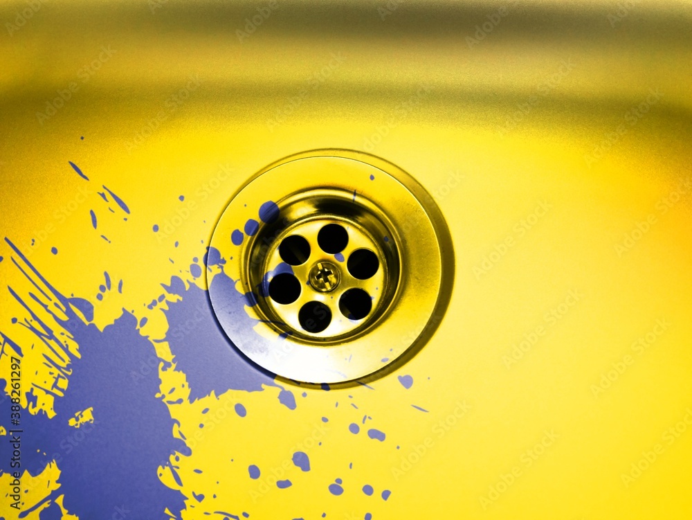 purple paint spilt into a gold coloured sink purple paint spilt into a gold coloured sink