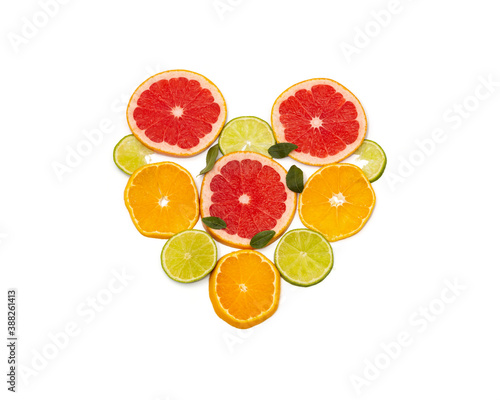 Slicing citrus fruits on a white background  in the form of a heart.