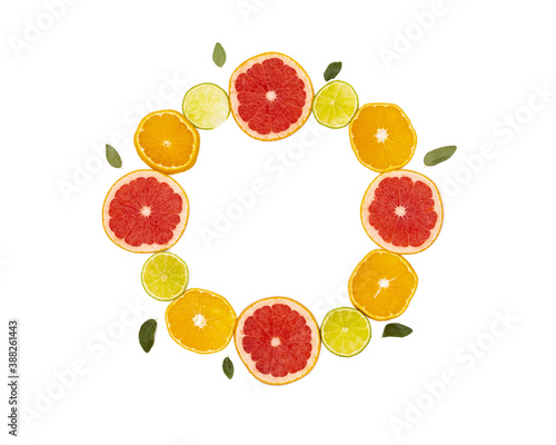 Slicing citrus fruits on a white background  laid out in a circle.