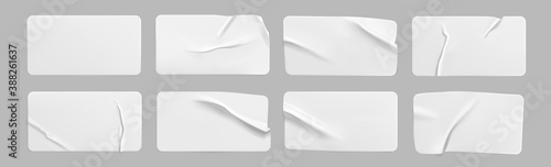 White glued crumpled rectangle stickers mock up set. Blank white adhesive paper or plastic sticker label with wrinkled and creased effect. Template label tags close up. 3d realistic vector photo