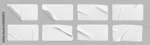 White glued crumpled stickers with curled corners mock up set. Blank white adhesive paper or plastic sticker label with wrinkled and creased effect.