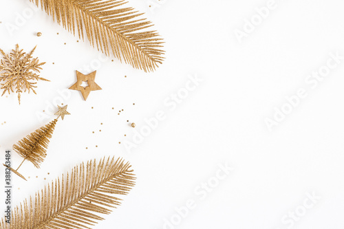 Christmas composition. Golden decorations on white background. Christmas  winter  new year concept. Flat lay  top view  copy space