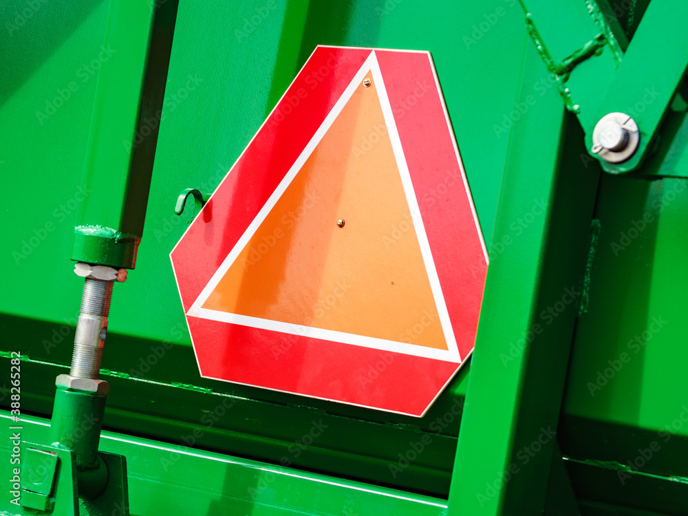 Warning triangle sign on agricultural machine - obrazy, fototapety, plakaty 