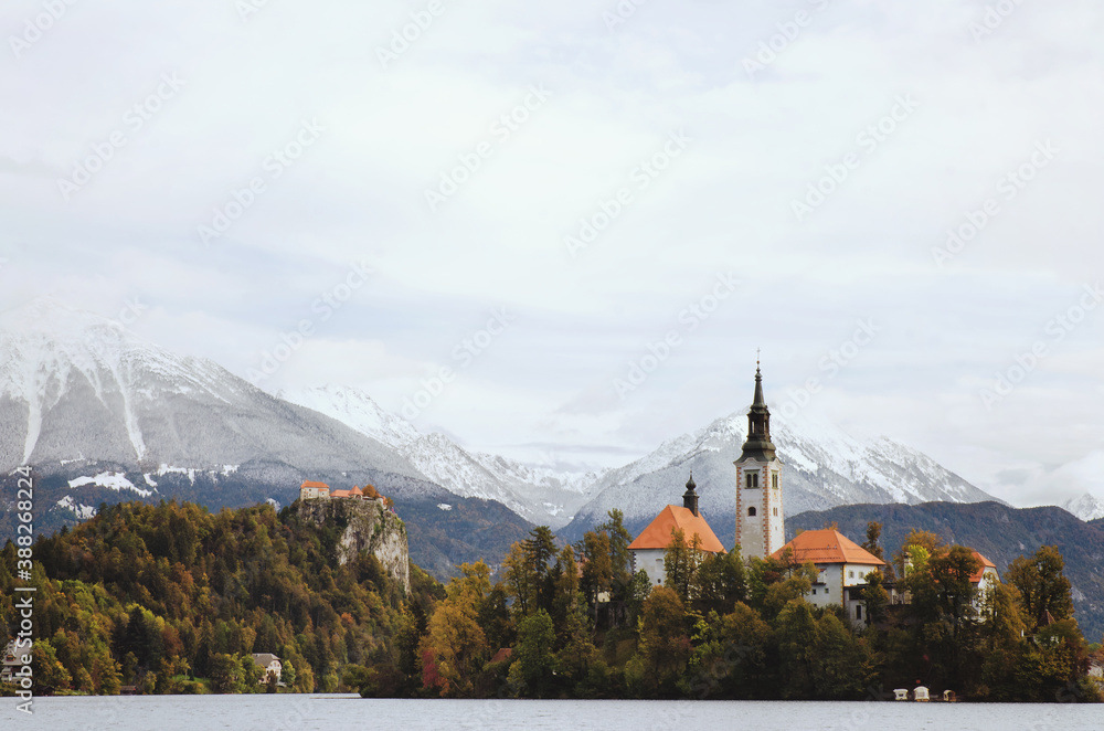 View of the snow-capped mountain peaks against the backdrop of lake Bled.