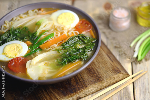 Appetizing Chinese noodle soup with bok choi cabbage. Chinese cuisine.