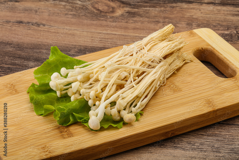 Raw Enoki mushrooms for cooking