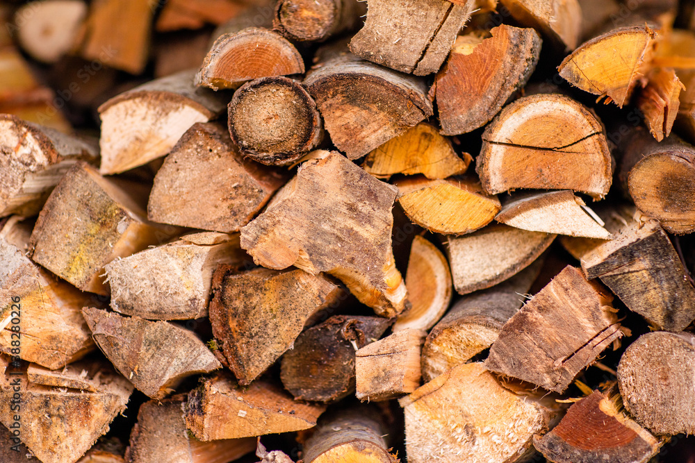 Christmas texture background of dry wooden log cabins. Woodpile of cut Lumber for forestry industry Christmas texture background of dry wooden log cabins. Woodpile of cut Lumber for forestry industry