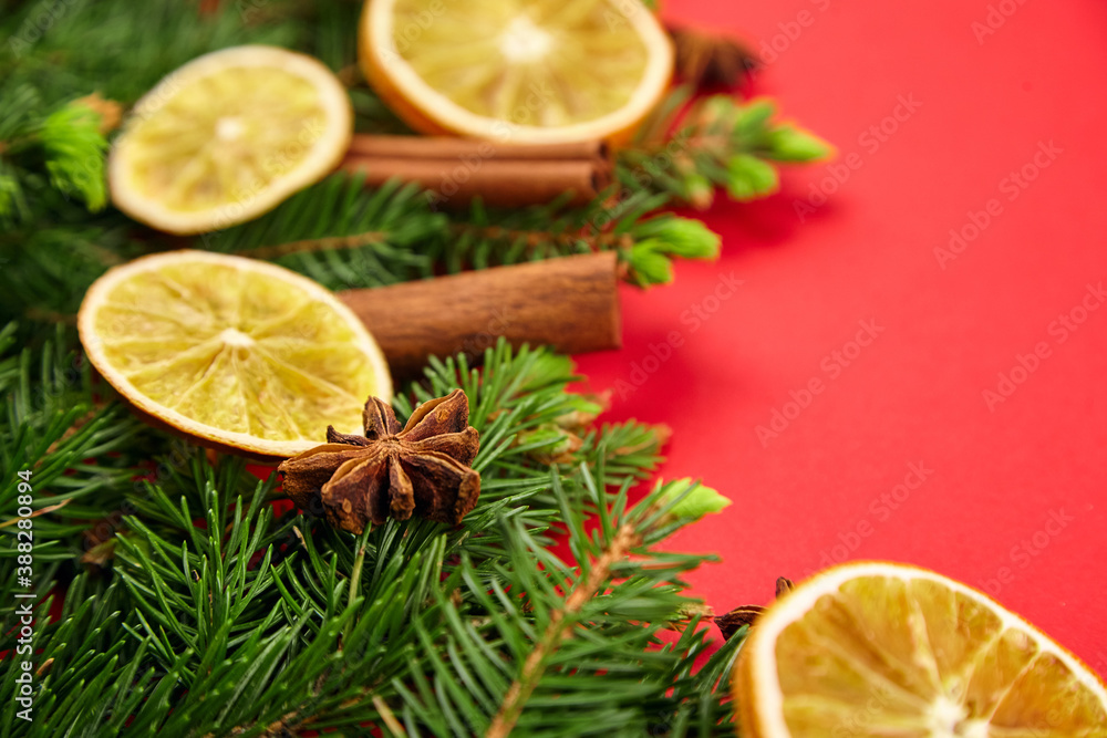 Composition with christmas tree branches, dry orange slices, cinnamon and anise spices Composition with christmas tree branches, dry orange slices, cinnamon and anise spices