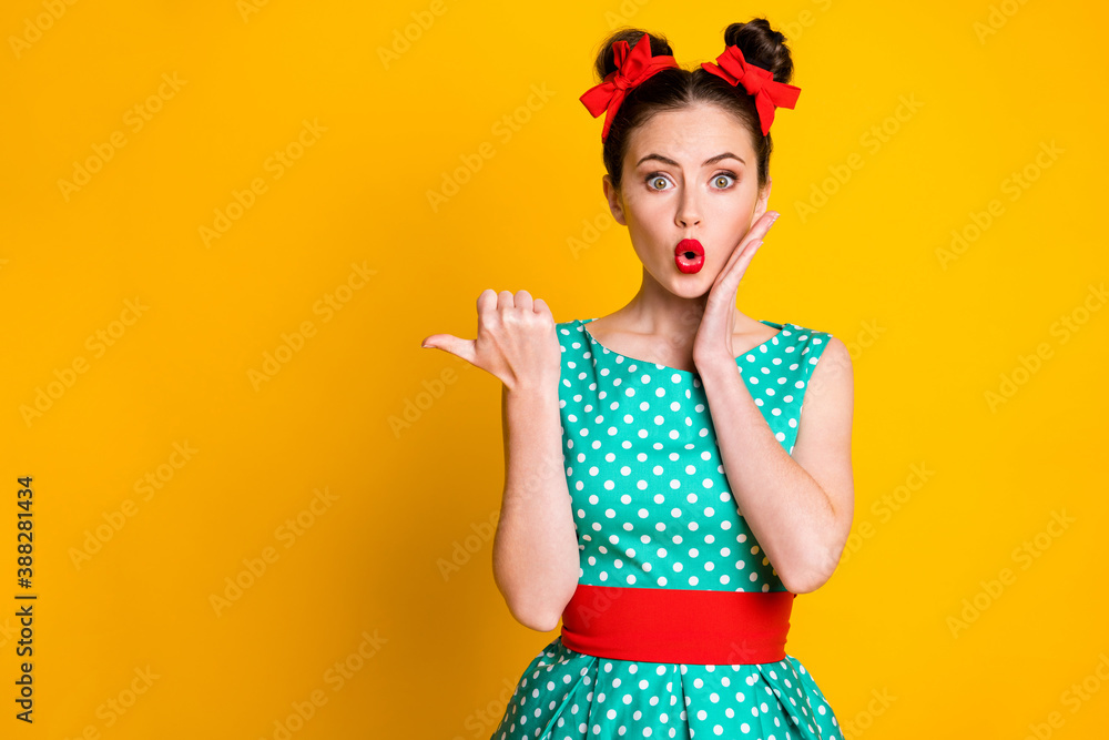 Portrait of lovely amazed wondered girl showing copy space look pout lips isolated over bright yellow color background Portrait of lovely amazed wondered girl showing copy space look pout lips isolated over bright yellow color background