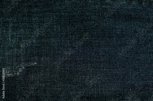 close up fabrics of dark blue jeans texture background