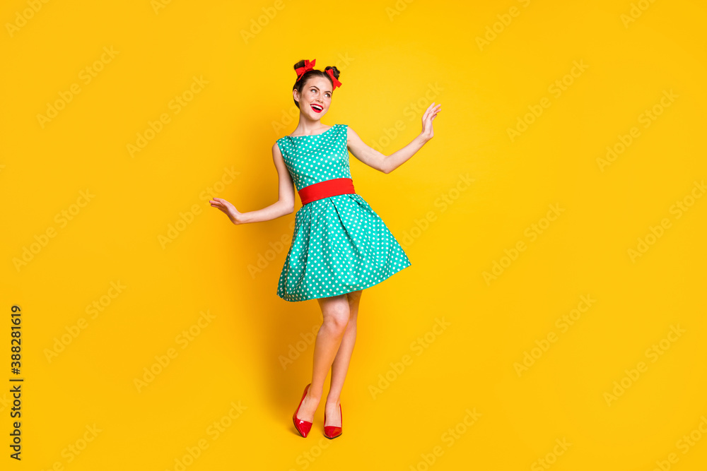 Full length body size view of nice charming cheerful girl wearing teal dress dancing posing isolated over bright yellow color background - obrazy, fototapety, plakaty 