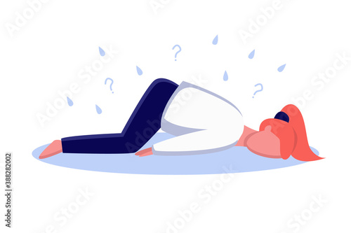 Emotional burnout woman lying on the floor, tired girl. Depressed woman with panic attack lying on floor hugging her knees scared and stressed