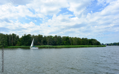 West pomerania landscape in Poland Wrzosowskie lake with sail boat in summer