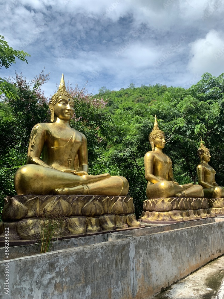 Row of golden Buddha Statue at Hua Khlum Monastic Residence, Suan phueng, Ratchaburi, Thailand. Row of golden Buddha Statue at Hua Khlum Monastic Residence, Suan phueng, Ratchaburi, Thailand.