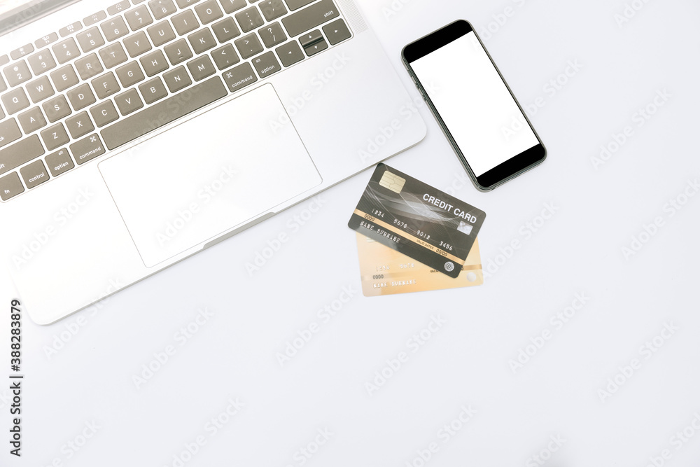 Fototapeta premium close up credit card laptop and amartphone on white background for online shopping