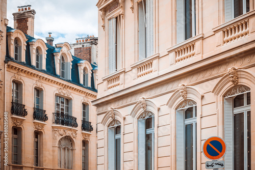 Antique building view in Paris city, France.