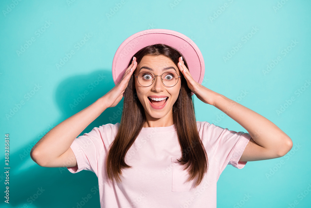 Photo of shiny funny girl lady dressed pink t-shirt retro cap open mouth arms head isolated turquoise color background Photo of shiny funny girl lady dressed pink t-shirt retro cap open mouth arms head isolated turquoise color background