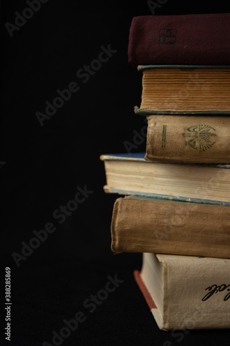 a stack of old books on the table