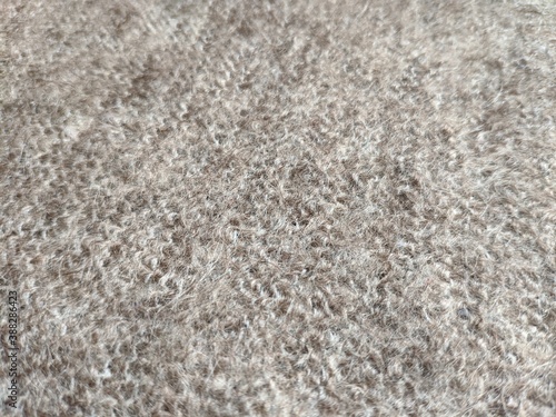 texture of grey knitted fabric made of natural wool