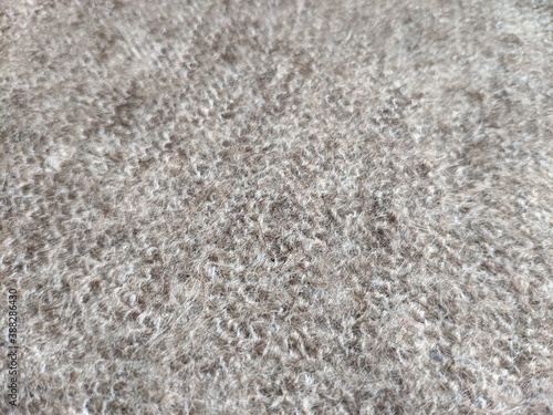 texture of grey knitted fabric made of natural wool