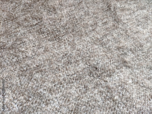 texture of grey knitted fabric made of natural wool