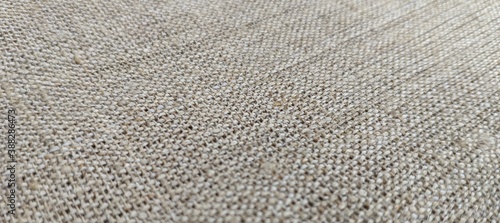 the texture of the beige linen fabric with natural