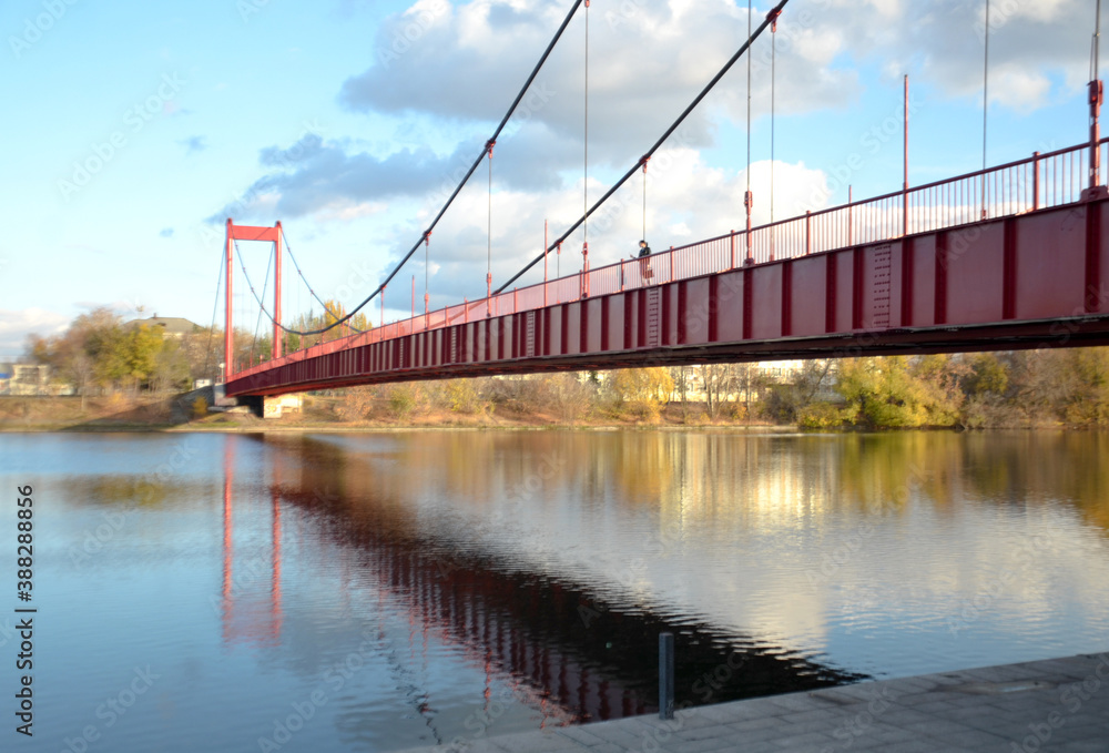 Fototapeta premium Russia Penza October 24, 2020: Druzhba suspension bridge on cables across the Sura river