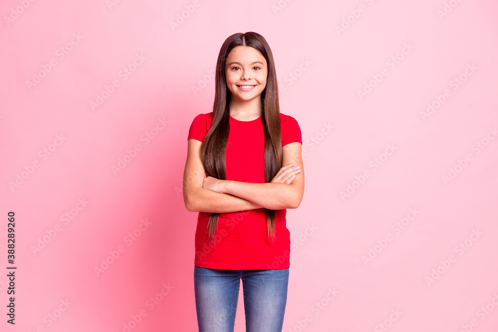 Photo of charming sweet little lady long hairstyle folded hands confident self-assured toothy shiny smile wear casual stylish red t-shirt jeans isolated pink color background Photo of charming sweet little lady long hairstyle folded hands confident self-assured toothy shiny smile wear casual stylish red t-shirt jeans isolated pink color background