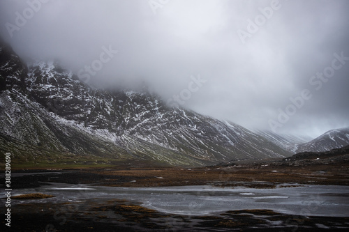 Fog over snow covered mountains in iceland landscape