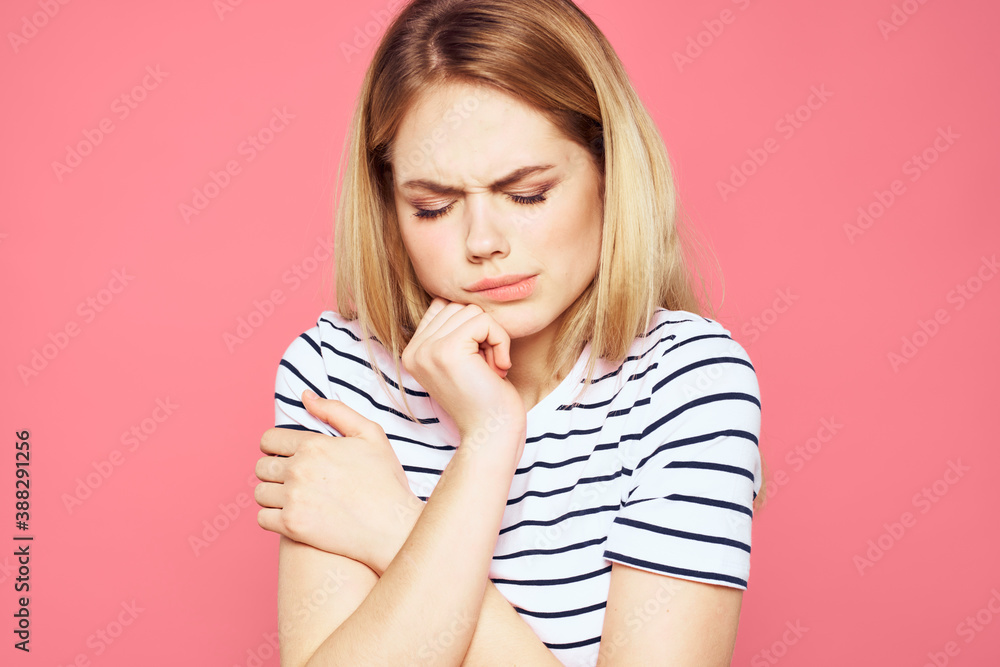 Blonde striped t-shirt emotion gesture hands displeased facial expression pink background Blonde striped t-shirt emotion gesture hands displeased facial expression pink background