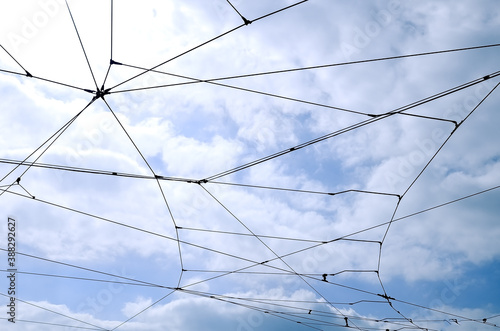 Wallpaper Mural Trolleybus wires against a blue sky with white clouds.. Torontodigital.ca