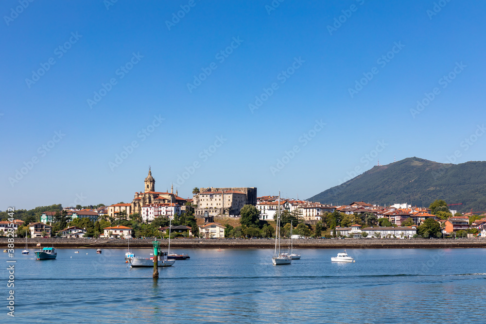 Naklejka premium Fuentarrabia, Basque Country, Spain - View to the village from the french side of the Bidassoa river