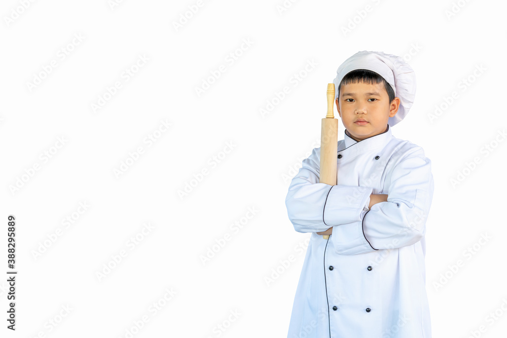 portrait asia, healthy boy in a kitchen white uniform and chef hat holding wooden rolling pin (equipment for cooking) isolated on white background with clipping path & copy space portrait asia, healthy boy in a kitchen white uniform and chef hat holding wooden rolling pin (equipment for cooking) isolated on white background with clipping path & copy space