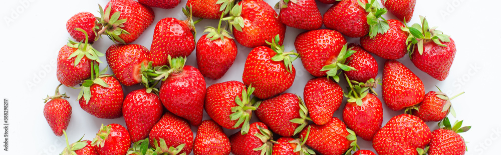 Plakat red raw fresh strawberries on white background, close view