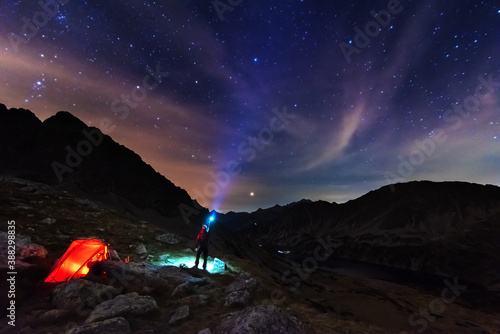 Starry nights in the High Tatras with a tourist in a tent on top