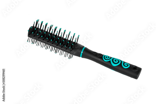 Massage plastic comb black isolate on a white background.