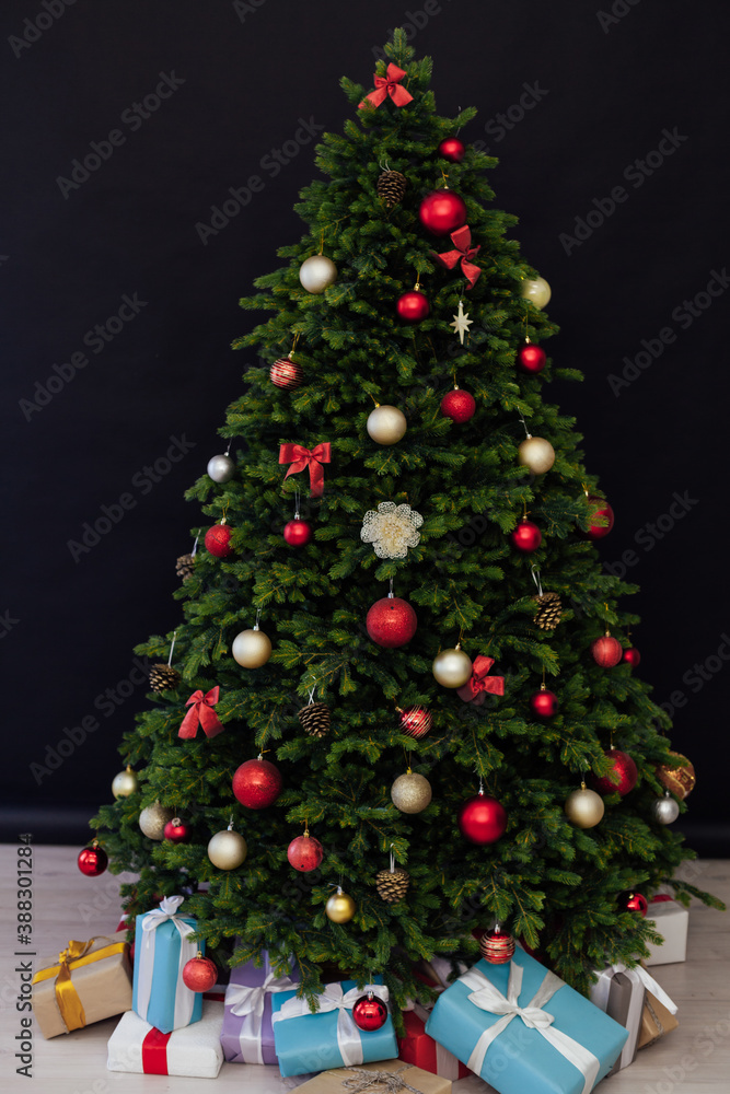 Christmas tree pine with gifts for the new year black decor winter