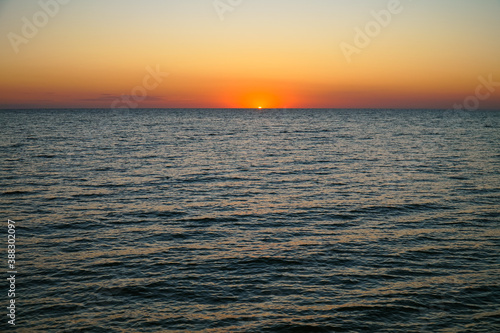 Sun rising over the sea. Dawn over the Sea of Azov. © ReitNN