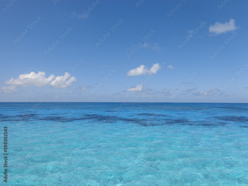 The stunning sunsets, beaches, coral reefs and huts on the Belize Islands in the Caribbean Sea