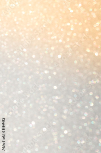 White and grey glitter bokeh circle glow blurred and blur abstract. Glittering shimmer bright luxury. White and silver glisten twinkle for texture wallpaper and background backdrop. 