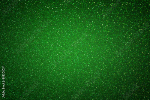 Green glitter bokeh circle glow blurred and blur abstract. Glittering shimmer bright luxury . White and silver glisten twinkle for texture wallpaper and background backdrop.
