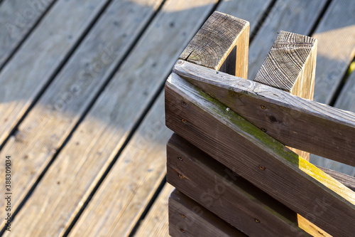 A close-up of the railing on a wooden terrace railing