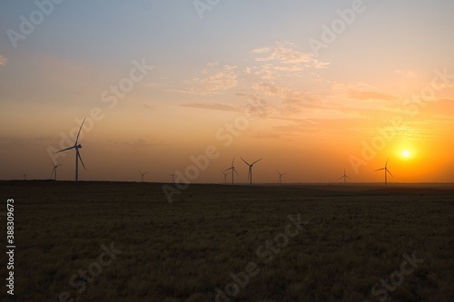 windmills in the field in the autumn evening