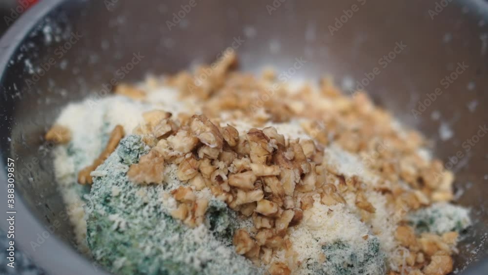 Walnuts falling in slow motion, into a pasta filling. Walnuts falling in slow motion, into a pasta filling.