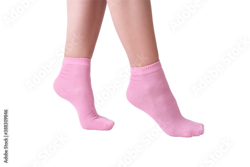 Woman female legs wearing pink striped plain cotton socks of classic style with elastic band isolated on white.