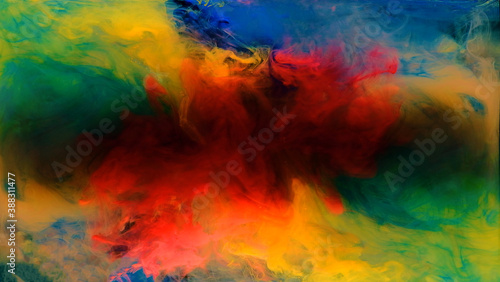 Color drops in water , abstract color mix , drop of ink color mix paint falling on background,