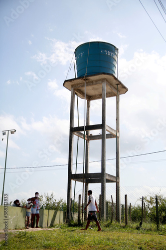 mata de sao joao, bahia / brazil - october 25, 2020: structure with a water tank for distribution to the community in the rural area in the city of Mata de Sao Joao. photo