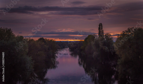Distant Rowers On The River Wye at Dusk