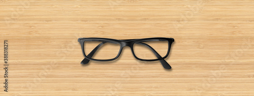 Black glasses isolated on wooden banner