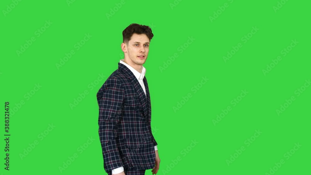 Businessman makes a back flip and shows cool gesture to camera after on a Green Screen, Chroma Key. Businessman makes a back flip and shows cool gesture to camera after on a Green Screen, Chroma Key.
